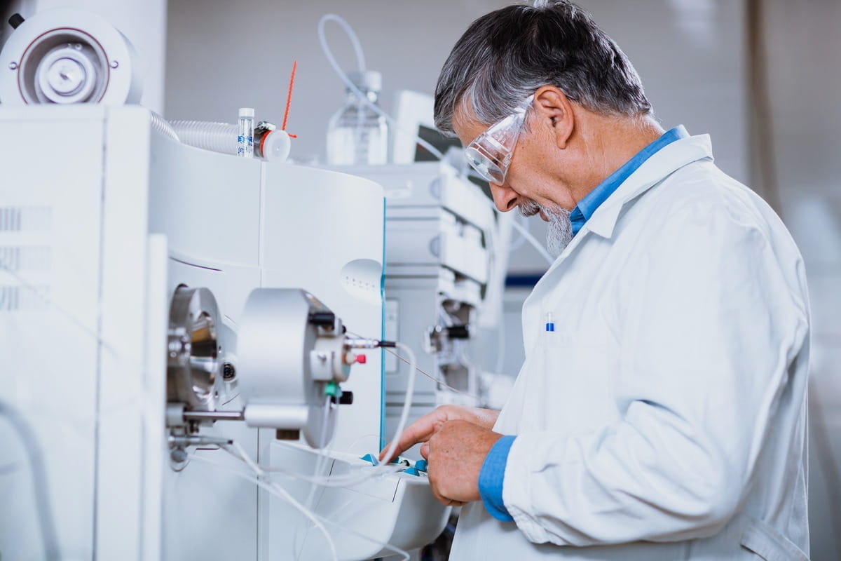 Scientist loading samples into a gas chromatography autosampler